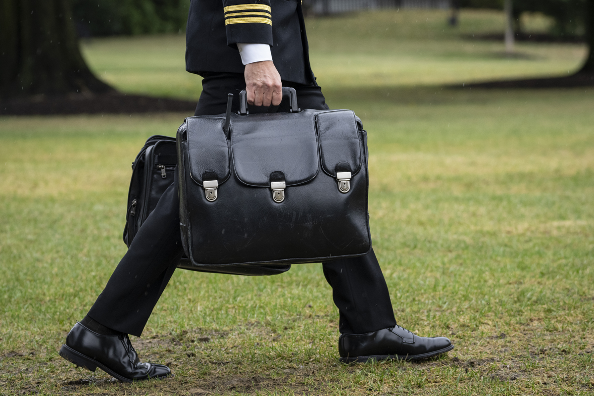 A military aide carries the "nuclear football," which contains launch codes for nuclear weapons, while walking to Marine One on the South Lawn of the White House October 3, 2022 in Washington, DC. President Biden is traveling to Puerto Rico on Monday, where he will outline a $60 million plan to help the island recover from Hurricane Fiona. (Photo: Drew Angerer/Getty Images)